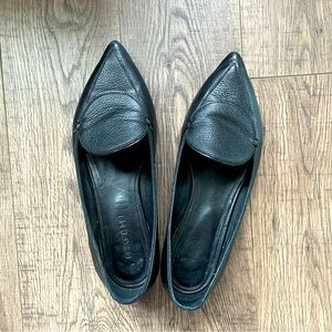Pebbled black leather pointed toe loafers